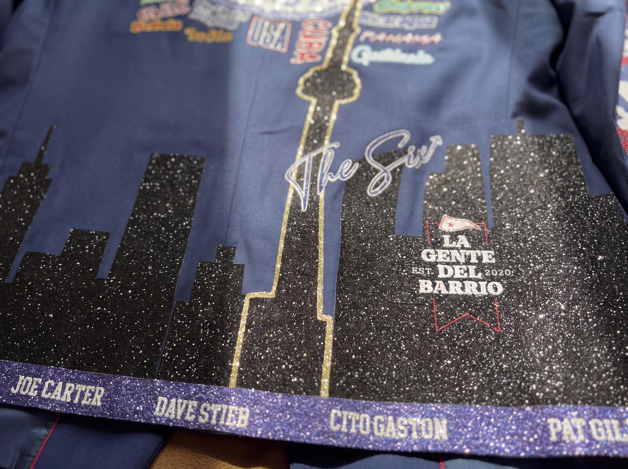 Close-up of the beaded city skyline running along the lower back of the blazer